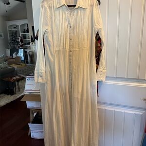 Free people white midi dress with liner and pockets. Buttons all the way down
